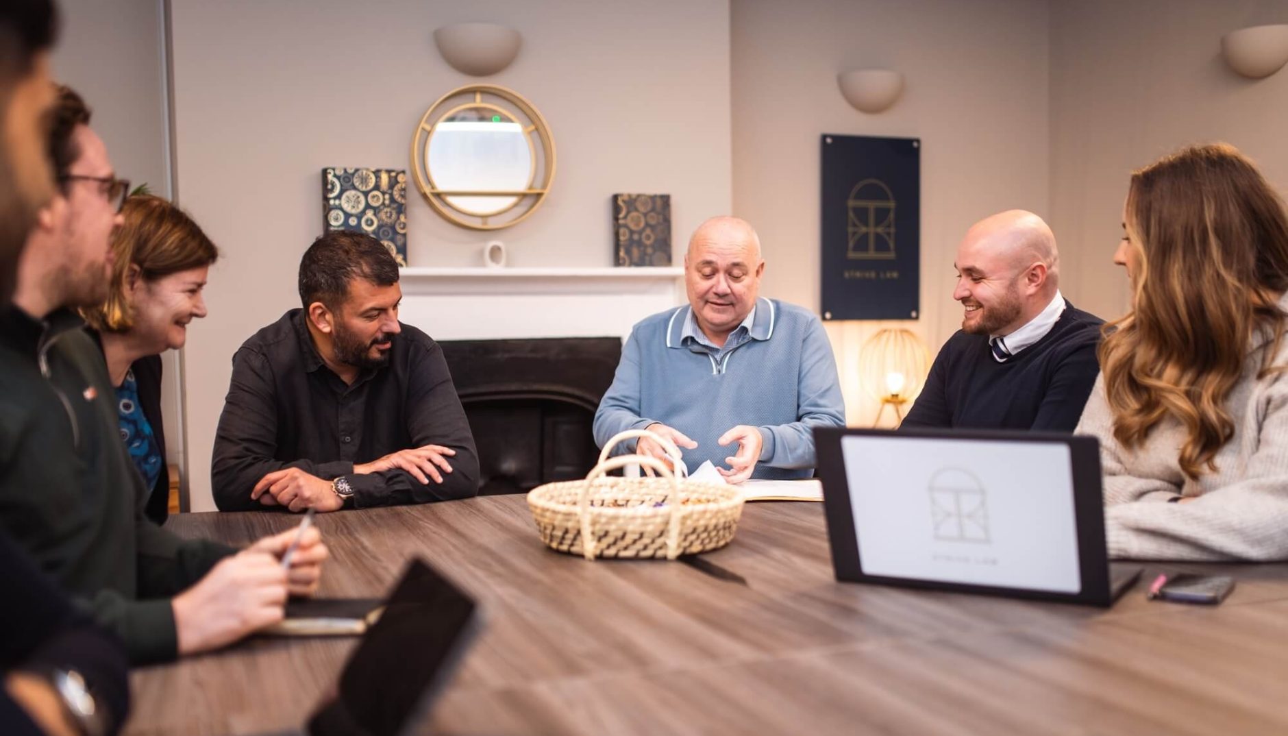 Business meeting around a conference table.